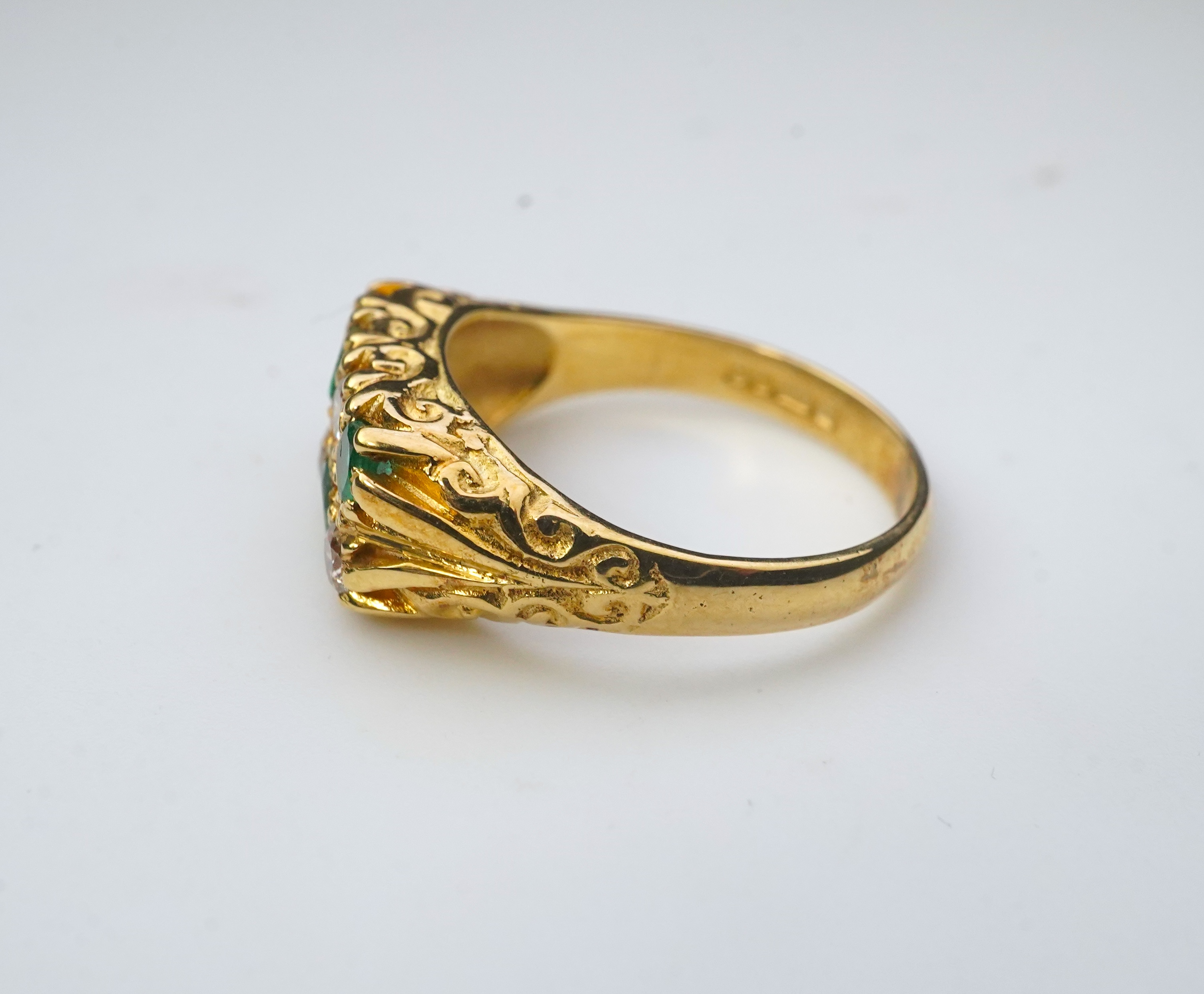 An emerald and diamond ring, circa 1975